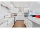 Well-lit kitchen featuring white cabinets, granite counters, stainless appliances, subway tile, and a convenient kitchen island at 41 Balsam Dr, Dallas, GA 30157