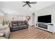 Inviting living room with a leather sofa, ceiling fan, and open layout, perfect for entertaining at 41 Balsam Dr, Dallas, GA 30157