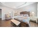 Spacious main bedroom with bench, trey ceilings, and ensuite bathroom featuring a soaking tub at 41 Balsam Dr, Dallas, GA 30157