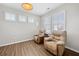 Sitting room with two comfy chairs and wood floors at 41 Balsam Dr, Dallas, GA 30157