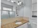 Bathroom with a granite countertop and updated fixtures at 470 Manor Oak Se Ln, Marietta, GA 30067