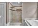 Bathroom with a glass-enclosed shower and large tub at 470 Manor Oak Se Ln, Marietta, GA 30067