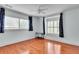 Cozy bedroom with hardwood floors, large windows, and floral curtains at 470 Manor Oak Se Ln, Marietta, GA 30067
