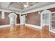 Spacious bedroom with hardwood floors, tray ceilings, and decorative wall trim detail at 470 Manor Oak Se Ln, Marietta, GA 30067
