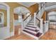 Grand foyer with a sweeping staircase and gleaming hardwood floors at 470 Manor Oak Se Ln, Marietta, GA 30067
