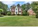 Beautiful two-story brick home with a large, well-maintained front yard at 470 Manor Oak Se Ln, Marietta, GA 30067