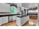 Modern kitchen with a center island, granite countertops, stainless steel appliances, and a cozy breakfast nook at 470 Manor Oak Se Ln, Marietta, GA 30067