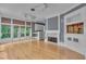 Elegant living room featuring hardwood floors, fireplace, built-ins, and access to a balcony with wooded views at 470 Manor Oak Se Ln, Marietta, GA 30067