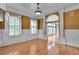 Bright living room featuring hardwood floors, wainscoting, a ceiling fan, and large windows at 470 Manor Oak Se Ln, Marietta, GA 30067