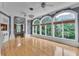 Bright living room with hardwood floors and large windows offering views of the surrounding greenery at 470 Manor Oak Se Ln, Marietta, GA 30067