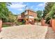 Rear exterior showing a brick home, fenced yard, and outdoor living space at 470 Manor Oak Se Ln, Marietta, GA 30067