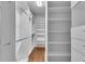 Organized walk-in closet with custom shelving and ample storage at 470 Manor Oak Se Ln, Marietta, GA 30067