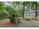 Outdoor stone fireplace and patio perfect for entertaining with spacious landscaped lawn at 635 Wilson Nw Rd, Atlanta, GA 30318