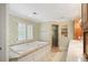 Bathroom with bathtub, shower with glass enclosure, and vanity with double sinks at 635 Wilson Nw Rd, Atlanta, GA 30318
