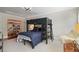 room includes bunk beds, an orange bookshelf, and a white chair with natural lighting at 635 Wilson Nw Rd, Atlanta, GA 30318