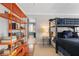 Bedroom featuring bunk beds, an orange bookcase, and a glimpse of a zebra-striped bathroom at 635 Wilson Nw Rd, Atlanta, GA 30318