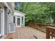 Spacious wooden deck perfect for outdoor entertaining with access to the screened in porch at 635 Wilson Nw Rd, Atlanta, GA 30318