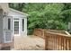 Large wooden deck with railing perfect for outdoor dining and access to backyard at 635 Wilson Nw Rd, Atlanta, GA 30318