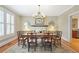 Formal dining room with a large wooden table and views of the kitchen at 635 Wilson Nw Rd, Atlanta, GA 30318