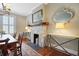 Elegant dining room with stone fireplace, hardwood floors, and sophisticated decor at 635 Wilson Nw Rd, Atlanta, GA 30318
