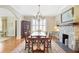 Elegant dining room with hardwood floors, stone fireplace, and traditional furnishings at 635 Wilson Nw Rd, Atlanta, GA 30318