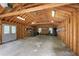 Spacious two car garage with exposed wood framing, storage shelves and lots of natural light at 635 Wilson Nw Rd, Atlanta, GA 30318