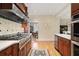 View of the kitchen with granite countertops and stainless steel appliances including a large stove at 635 Wilson Nw Rd, Atlanta, GA 30318