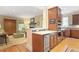 Stylish kitchen flows into the living area featuring stone fireplace and natural light at 635 Wilson Nw Rd, Atlanta, GA 30318