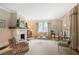 Spacious living room featuring a stone fireplace, ample seating, and bright windows at 635 Wilson Nw Rd, Atlanta, GA 30318