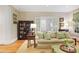 Bright living room with hardwood floors, comfortable seating, and view to a window-lined office at 635 Wilson Nw Rd, Atlanta, GA 30318