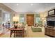 Inviting living room with stone fireplace, neutral decor, and views to an adjacent room at 635 Wilson Nw Rd, Atlanta, GA 30318