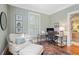 Well-lit home office with a comfortable chair, desk, and built-in shelves providing ample space at 635 Wilson Nw Rd, Atlanta, GA 30318