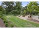Charming community playground and green space with bench swings and mature trees at 635 Wilson Nw Rd, Atlanta, GA 30318