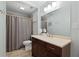 Well-lit bathroom with a modern vanity, neutral tile, and a shower-tub combination at 1217 Club Walk Ne Dr, Brookhaven, GA 30319