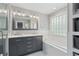 Luxury bathroom featuring double sinks, soaking tub and glass block window at 1217 Club Walk Ne Dr, Brookhaven, GA 30319