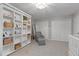 Spacious bedroom offers a large built-in bookcase with a reading nook with chair at 1217 Club Walk Ne Dr, Brookhaven, GA 30319