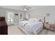 Bright bedroom with neutral colors, a ceiling fan, and doors to the backyard at 1217 Club Walk Ne Dr, Brookhaven, GA 30319