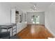 Versatile bonus room with hardwood floors, built-in storage, and French doors leading to the outside at 1217 Club Walk Ne Dr, Brookhaven, GA 30319
