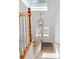 Welcoming entryway featuring wood and carpeted stairs, a lantern chandelier, and front door with glass panels at 1217 Club Walk Ne Dr, Brookhaven, GA 30319