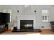 Elegant fireplace with black marble hearth and white mantel, creating a cozy focal point at 1217 Club Walk Ne Dr, Brookhaven, GA 30319