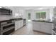 Modern kitchen with stainless steel appliances, granite countertops, and ample cabinet space at 1217 Club Walk Ne Dr, Brookhaven, GA 30319
