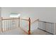 Bright upstairs landing featuring a skylight and white railings with wood posts at 1217 Club Walk Ne Dr, Brookhaven, GA 30319