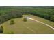 An elevated shot of a home shows the property's vast yard at 1423 Hillcrest Rd, Bowdon, GA 30108