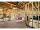 Unfinished basement framed with wooden studs, offering potential for customization at 1423 Hillcrest Rd, Bowdon, GA 30108