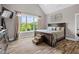 Bedroom featuring natural light, wood floors, and unique pet steps for the bed at 1423 Hillcrest Rd, Bowdon, GA 30108