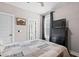 A well-lit bedroom with modern furnishings, a ceiling fan, and an ensuite bathroom at 1423 Hillcrest Rd, Bowdon, GA 30108
