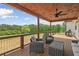 A spacious deck offers outdoor seating with views of the tree-lined backyard at 1423 Hillcrest Rd, Bowdon, GA 30108