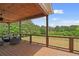 A relaxing outdoor deck features seating with views of the property's beautiful scenery at 1423 Hillcrest Rd, Bowdon, GA 30108