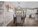 Elegant dining room with seating for six and views of the well-equipped kitchen at 1423 Hillcrest Rd, Bowdon, GA 30108