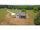 Stunning home featuring a large lot, modern farmhouse style, and inviting outdoor deck perfect for entertaining at 1423 Hillcrest Rd, Bowdon, GA 30108